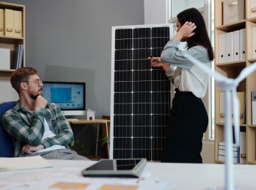 manager-and-engineer-discussing-solar-panel