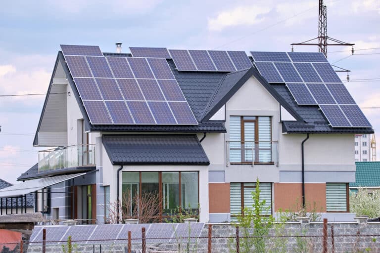 residential-house-with-rooftop-covered-with-solar-photovoltaic-panels-producing-clean-ecological-electrical-energy-suburban-rural-area