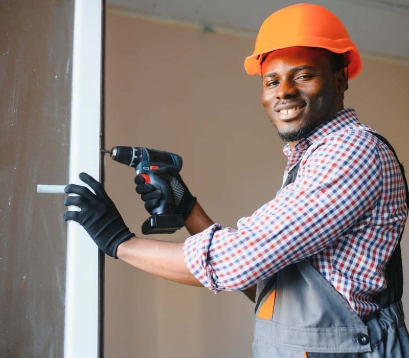 african american workman in overalls installing, Common mistakes in solar panel installation